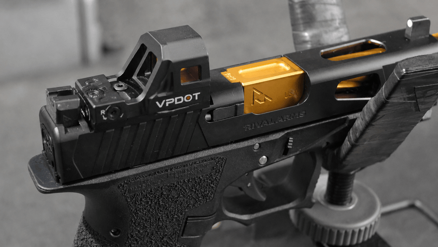 VPDOT D300X red dot sight mounted on carry pistol after training session, on range bag